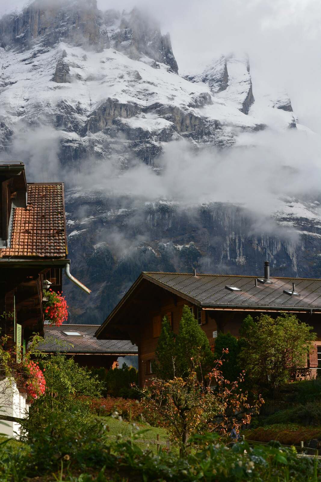 Chalets of Grindelwald village set against steep Alpine peaks