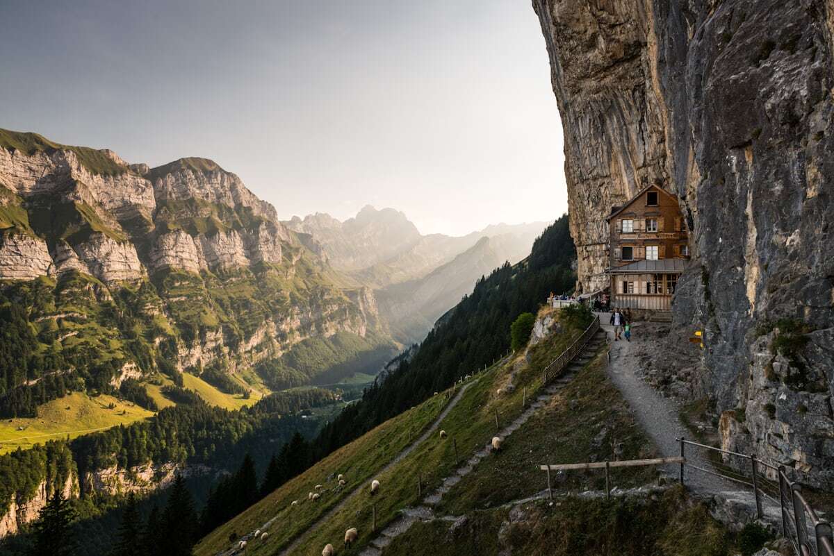 The Aescher guesthouse under an overhanging cliff at Ebenalp