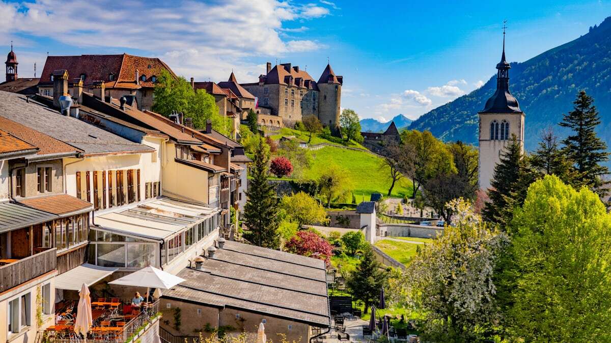 Cobbled main street and castle of medieval Gruyères