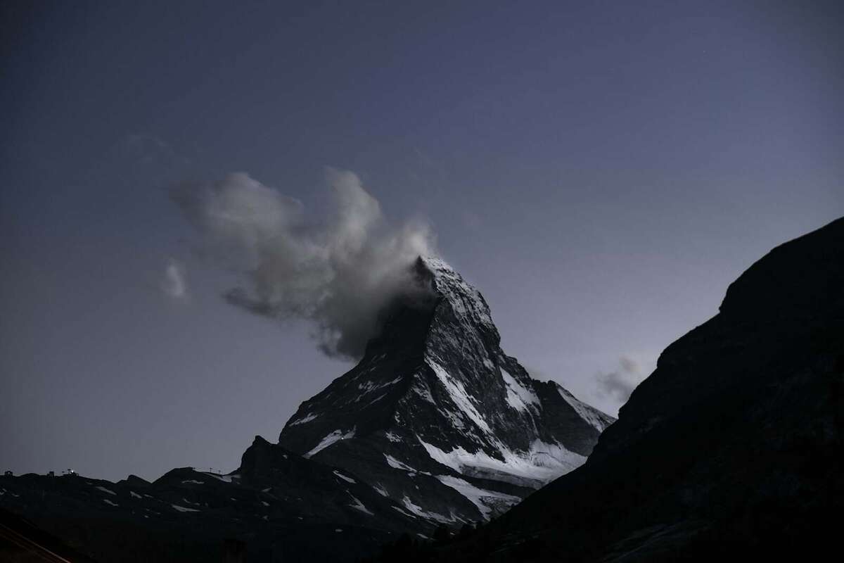 The Matterhorn glowing at sunrise above the village of Zermatt
