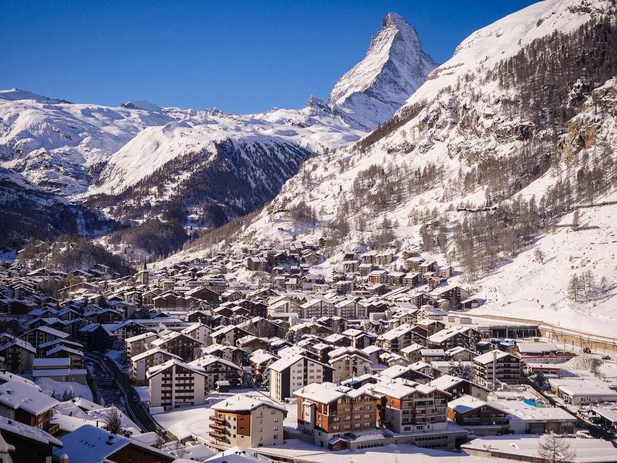 The Matterhorn framed behind chalets from the Kirchbrücke in Zermatt