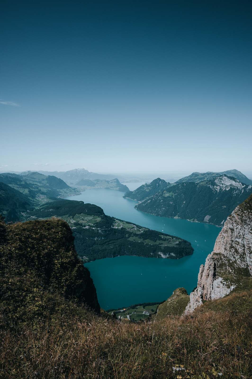 A turquoise lake framed by steep green mountains near Interlaken