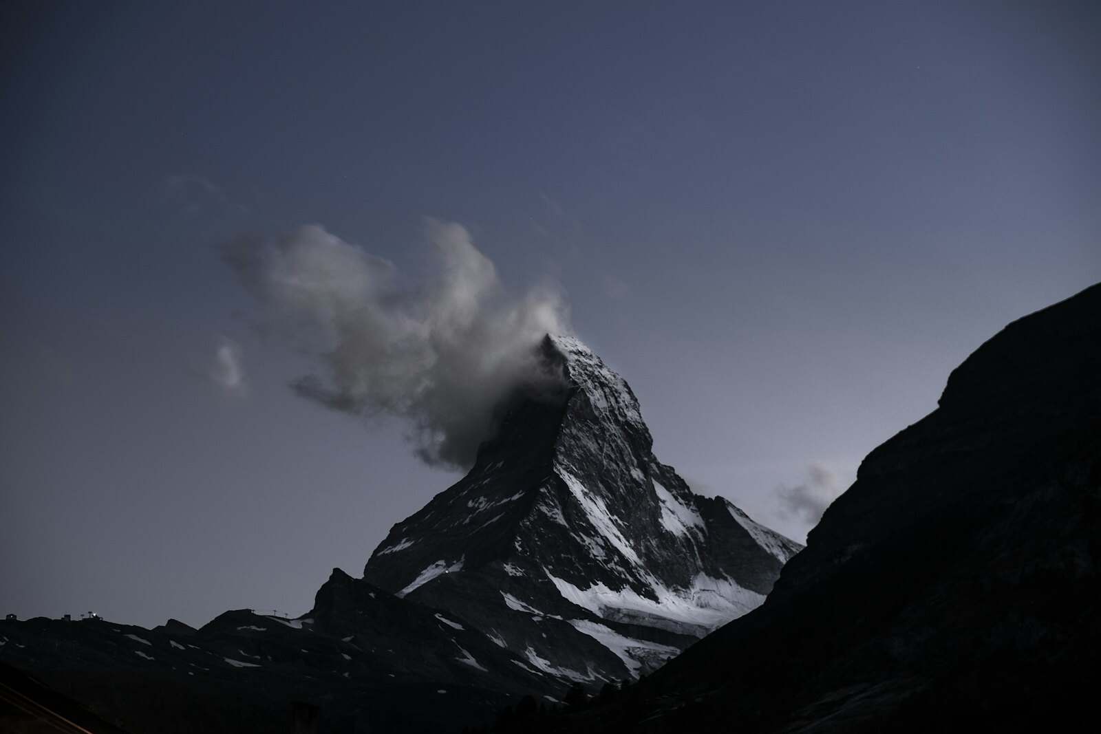 The Matterhorn rising above the rooftops of Zermatt at sunrise